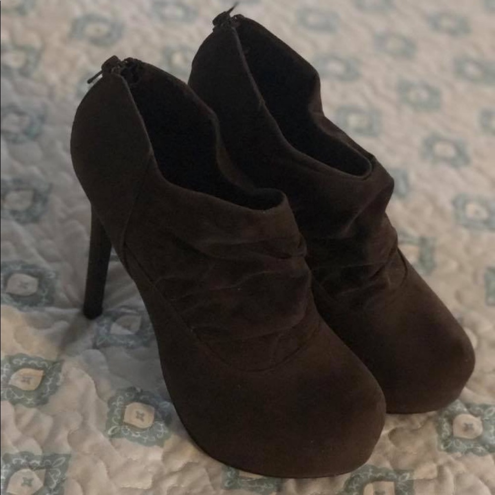 Closed toe brown heels.